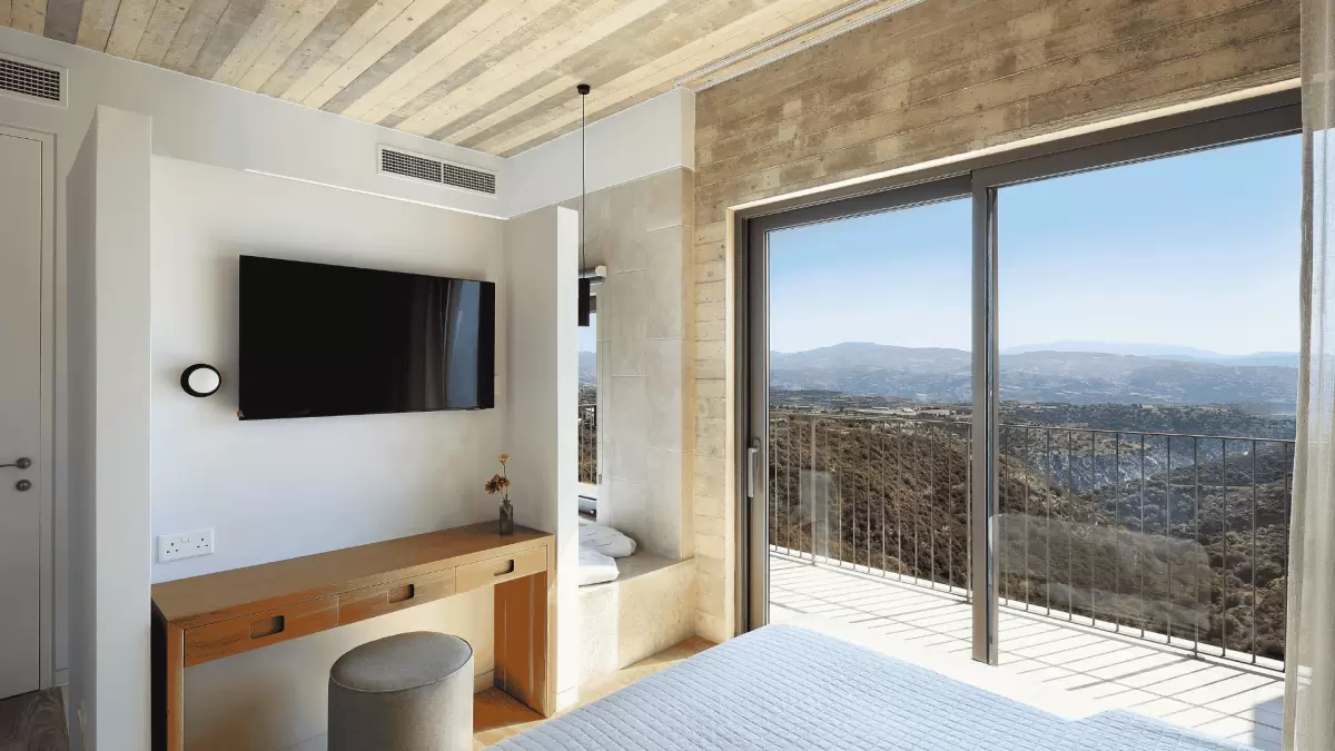 The view across Paphos as seen from the bedroom of one of the Ezousa suite properties at Minthis Resort.