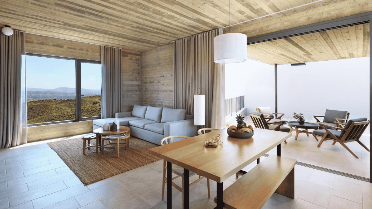 The living room view from Ezousa suites at Minthis Resort looking out over the nearby Paphos mountain range.