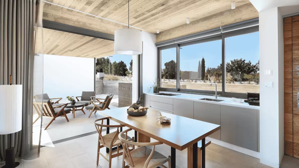 The exterior view from the kitchen of Minthis Resort from an Ezousa Suites property