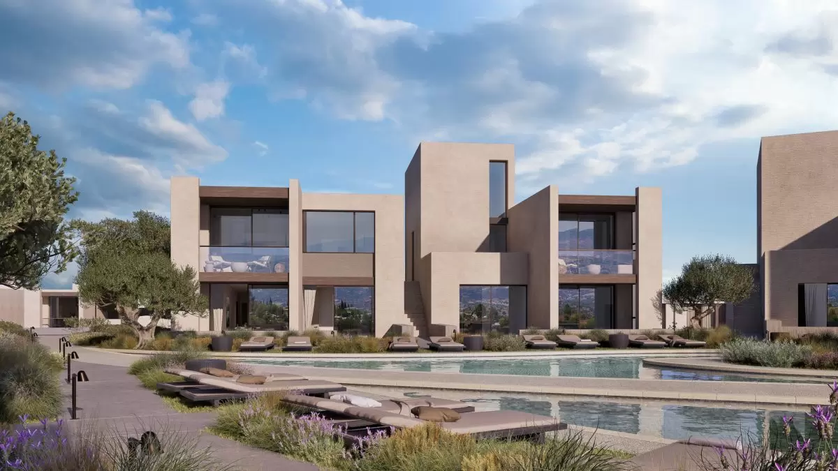 An exterior shot of the Lofos apartments available for sale at Minthis resort. 