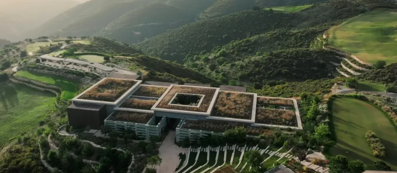 A birdseye view of the Minthis Spa with the golf course visible in the background