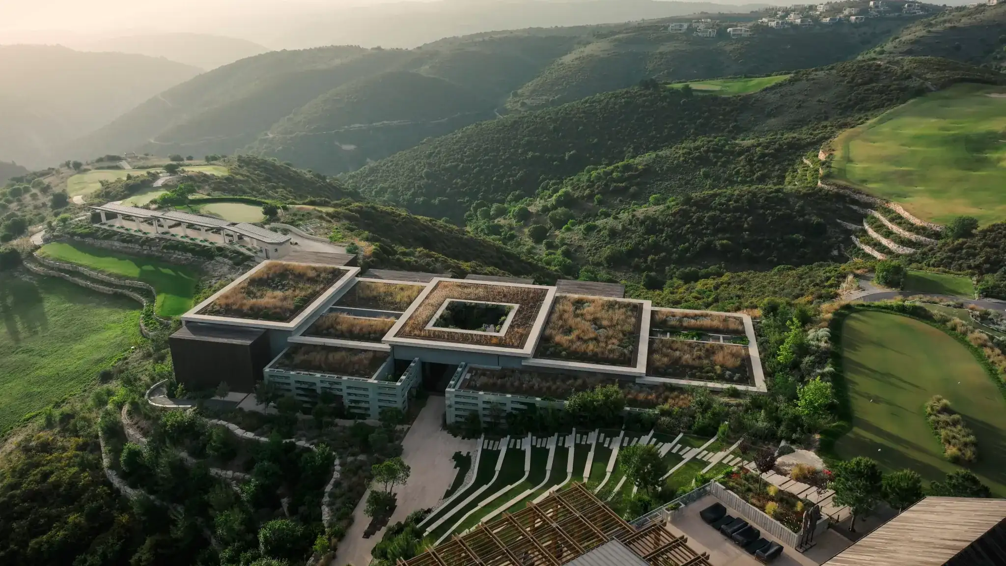 A birdseye view of the Minthis Spa with the golf course visible in the background