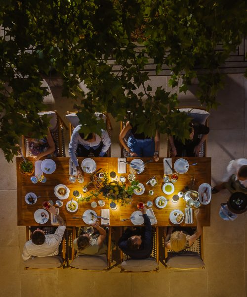 An overhead camera shot of a table indulging in celebrations at Amaracus restaurant in Paphos, Cyprus