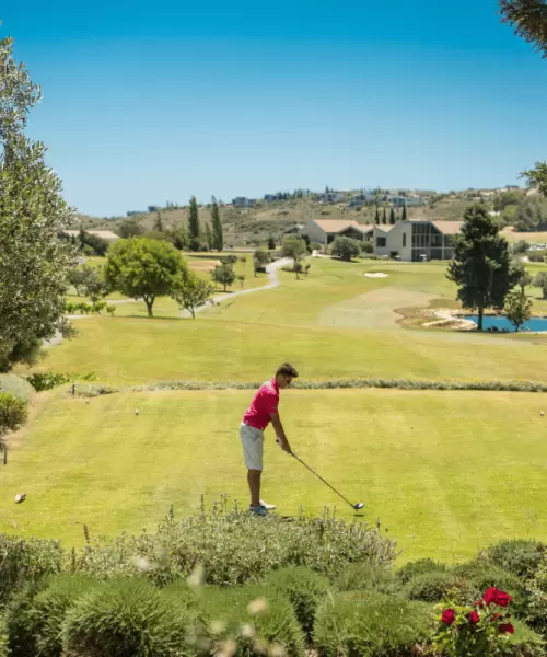 A golfer tees off from the Paphos Golf Course at Minthis