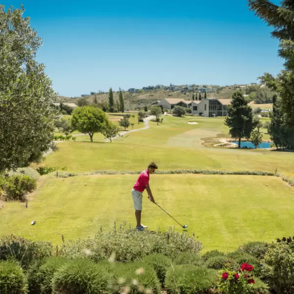 A golfer tees off from the Paphos Golf Course at Minthis