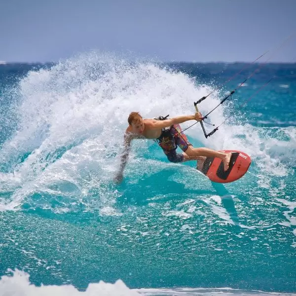 A windsurfer traversing across waves through the Mediterranean Sea in Paphos, Cyprus